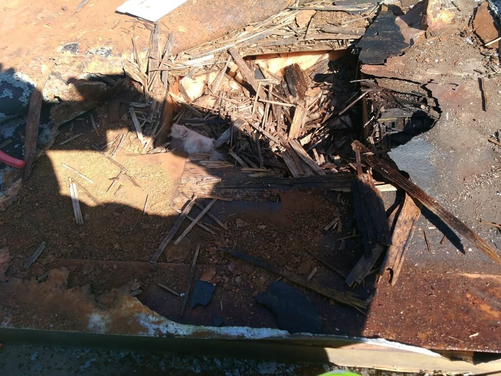 Rotted roof decking and insulation exposed during a roof repair in Maryland